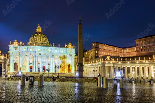 St. Peter's square in Vatican at night, center of Rome, Italy (translation "Follow me")