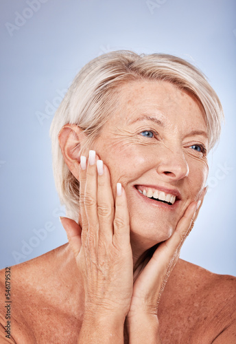 Skincare  thinking and senior face of woman with smile for natural cosmetic  wellness and dermatology treatment. Wrinkles  happiness and mature model touching skin with self love in gray studio.