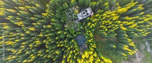 Ruins of former tin mine near Rolava village in the forests of Ore Mountains, Czech Republic. Aerial view from drone. photo