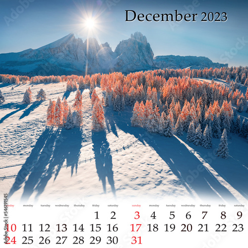 Square wall monthly calendar ready for print, December 2023. Set of calendars with beautiful landscapes. Aerial winter view of Alpe di Siusi village with Plattkofel peak on background, Ityaly, Europe. photo