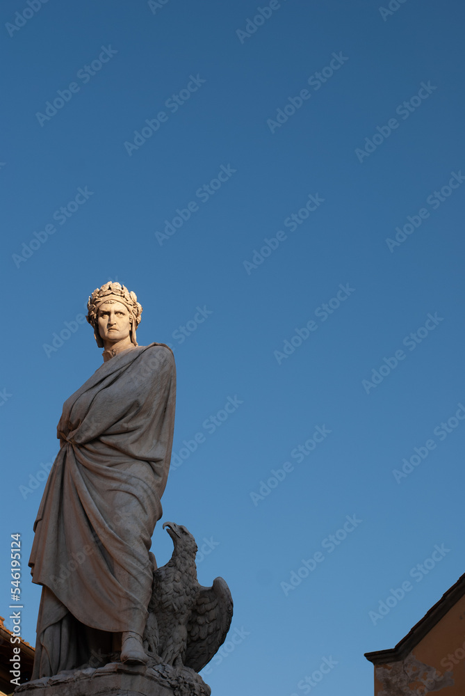 Fototapeta premium Sculpture of Dante Alighieri by sunset light