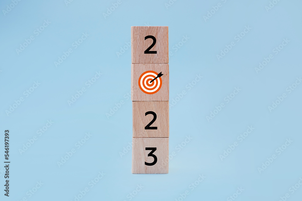 2023 with goal icon on table and blue background, copy space. Start new year 2023 with goal plan, goal concept, action plan, strategy, new year business vision 2023 with goal icon on table and blue background, copy space. Start new year 2023 with goal plan, goal concept, action plan, strategy, new year business vision