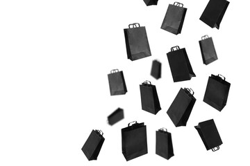 Black sale shopping bags are flying on transparent background with copy space. Sale banner concept. PNG.