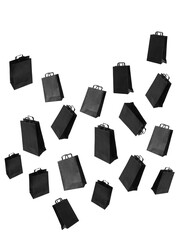 Pattern with black sale shopping bags are flying and sparkles on grey background with copy space