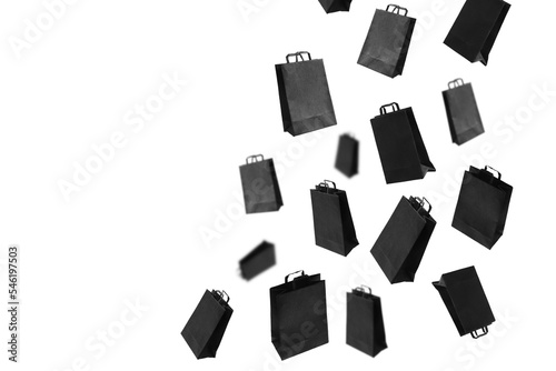 Black sale shopping bags are flying on transparent background with copy space. Sale banner concept. PNG.