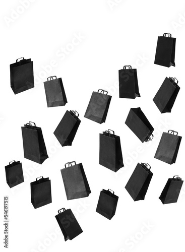 Pattern with black sale shopping bags are flying and sparkles on grey background with copy space