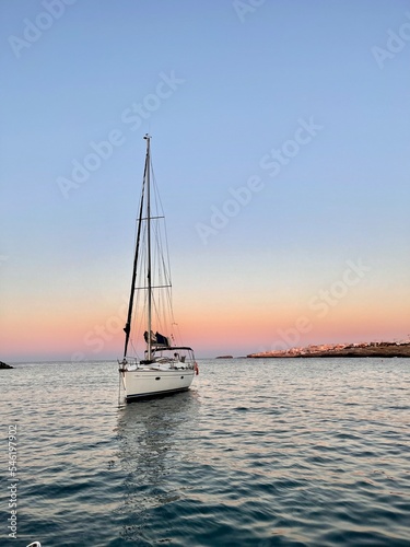 sailboat at sunset © Poliana