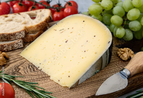 Photography А piece of cheese with truffle on a cutting board
