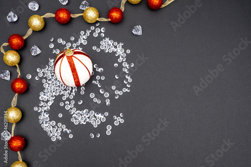 Christmas background, Santa Claus hat, snowflakes, Christmas decorations, New Year atmosphere. Christmas tree, ice floes, bells, empty space for invitation.