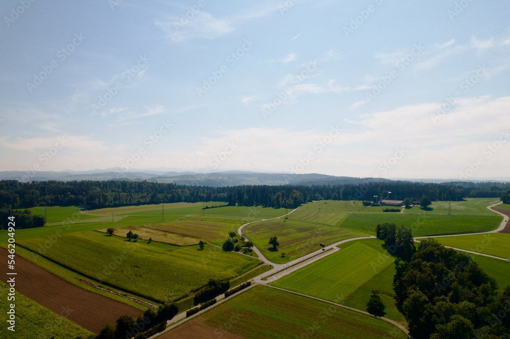 Aerial view of agriculture landscape around rural village of Kyburg, Canton Zürich, on a sunny late summer day. Photo taken September 2nd, 2022, Kyburg, Switzerland.