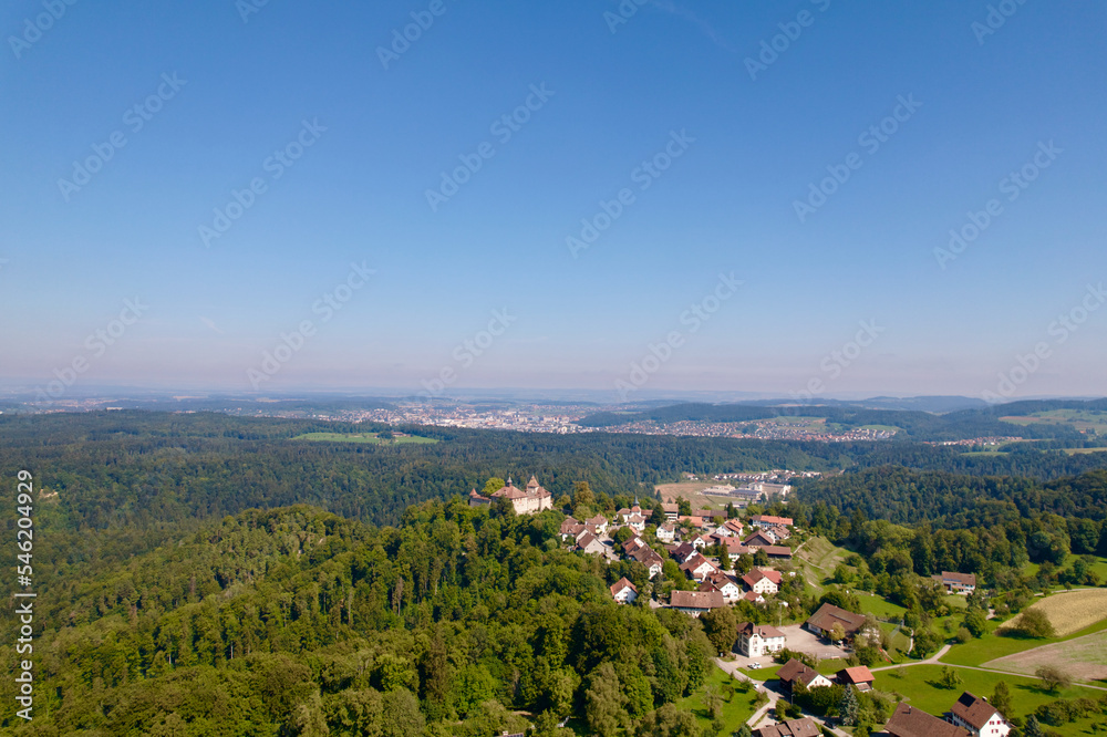 Aerial view of Kyburg village and castle, Canton Zürich, and scenic landscape on a sunny late summer day. Photo taken September 2nd, 2022, Kyburg, Switzerland.