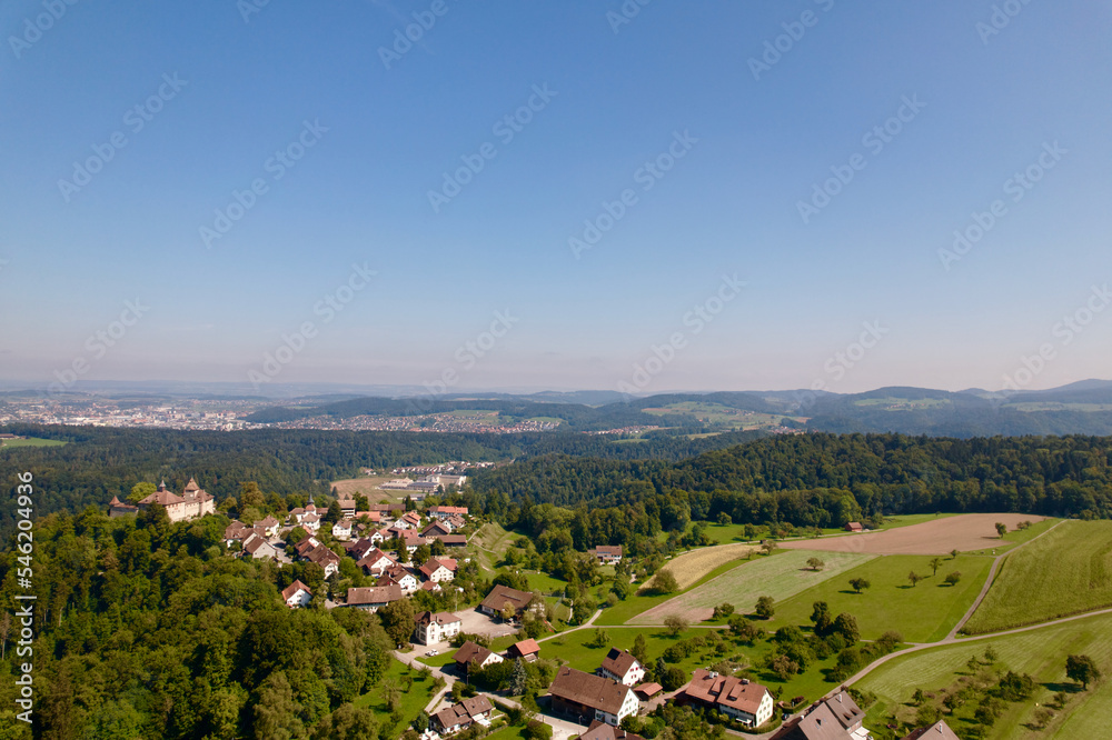Aerial view of Kyburg village and castle, Canton Zürich, and scenic landscape on a sunny late summer day. Photo taken September 2nd, 2022, Kyburg, Switzerland.