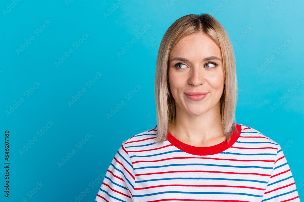 Portrait of good-looking caucasian woman laughing while looking aside standing against blue background. Positive fashionable girl Portrait of good-looking caucasian woman laughing while looking aside standing against blue background. Positive fashionable girl