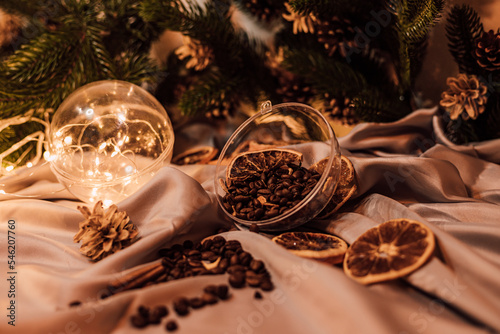 Christmas composition with coffee beans, dried oranges and garland