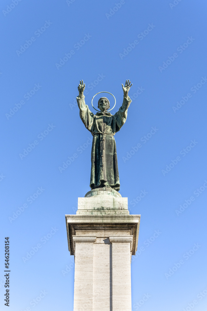 Bronze monument to St Francis of Assisi in Risorgimento Square, built in early 20th century, Milan, Lombardy region, Italy