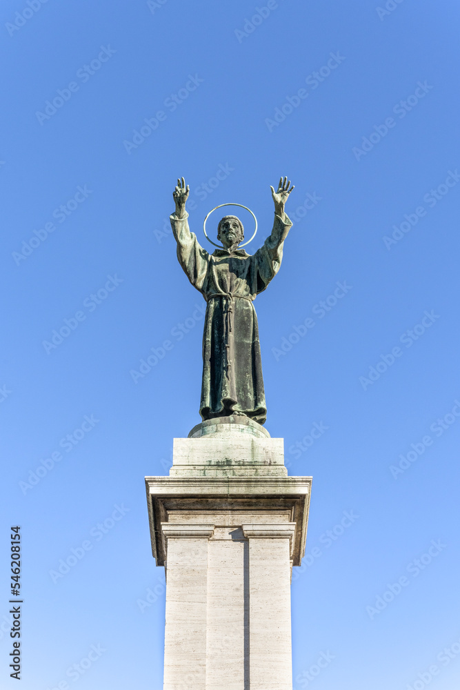 Bronze monument to St Francis of Assisi in Risorgimento Square, built in early 20th century, Milan, Lombardy region, Italy Bronze monument to St Francis of Assisi in Risorgimento Square, built in early 20th century, Milan, Lombardy region, Italy