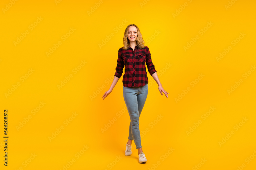 Full length view of nice-looking dreamy cheerful glad wavy-haired girl waking isolated on bright color background Full length view of nice-looking dreamy cheerful glad wavy-haired girl waking isolated on bright color background