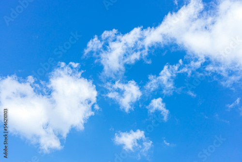 Clouds in the blue sky. Natural sky background texture  beautiful color. Peaceful blue sky with light clouds. The free form beauty of clouds and sky is perfect for background  backdrop and wallpaper.