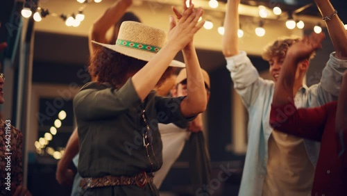 Group of Multicultural Diverse Friends and Relatives Having Fun and Dancing Together at a Garden Party Celebration. Beautiful and Handsome Young and Old People Having Fun. Slow Motion Footage.