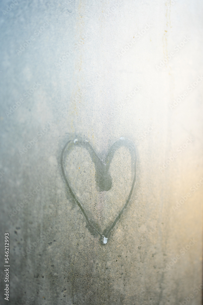 Heart shape drawing on fogged up glass Heart shape drawing on fogged up glass