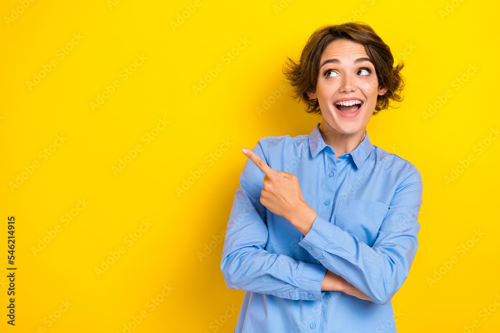 Closeup photo of young adorable pretty girl wear blue denim shirt worker ceo owner company finger point information excited isolated on yellow color background