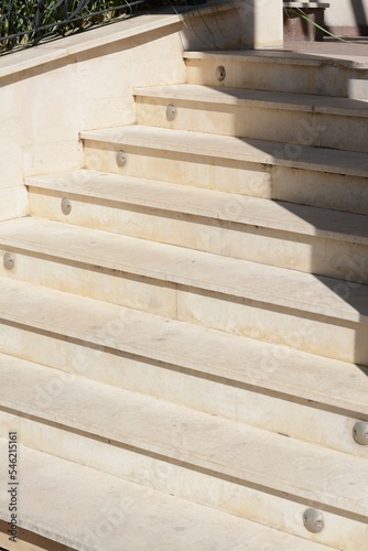 Staircase covered with tiles outdoors on sunny day, closeup © New Africa