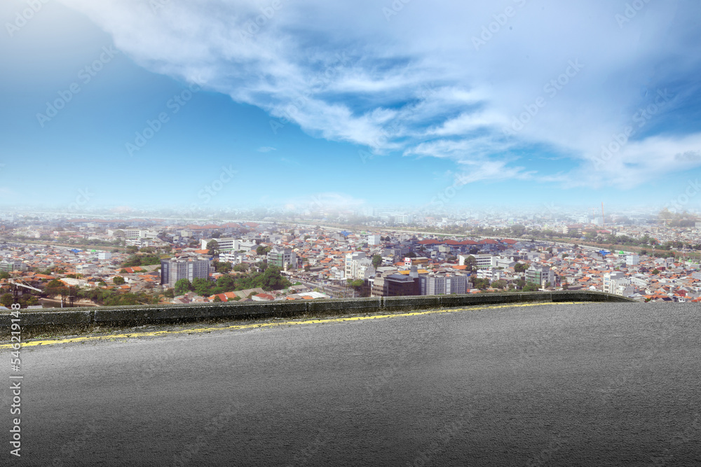 Fototapeta premium Asphalt road with modern building and skyscrapers