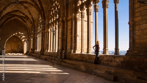 Tableau sur toile woman looking at city landscape view in a cloister- Lerida in Catalonia