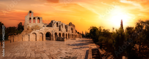 Historic Landmark, Odeon of Herodes Atticus, in the Acropolis of Athens, Greece. Panoramic View with Dramatic Sunset Sky Art Render.