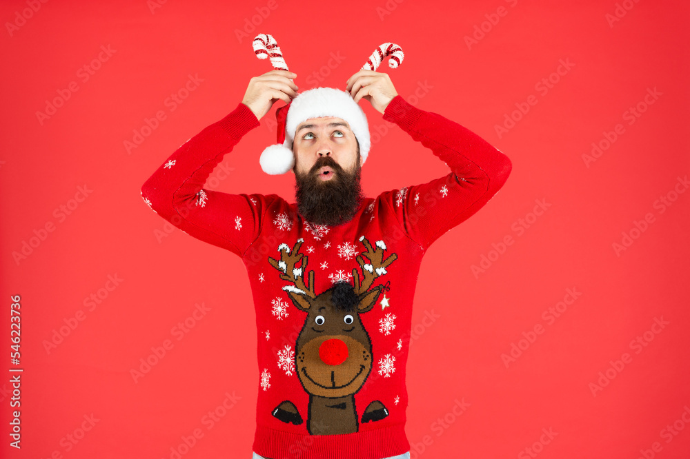 mature guy with holiday decoration on red background. happy new year. merry christmas.