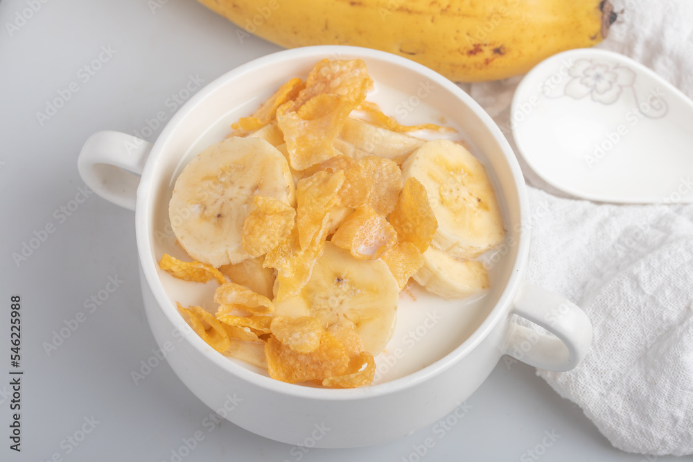 Cornflakes breakfast, banana, fresh milk, healthy food Cornflakes breakfast, banana, fresh milk, healthy food