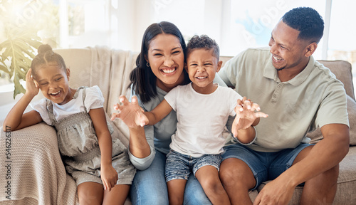 Love, black family and being happy, silly and have fun together on couch in living room. Parents, mother and father with children, happiness and bonding on sofa in lounge for quality time or playful