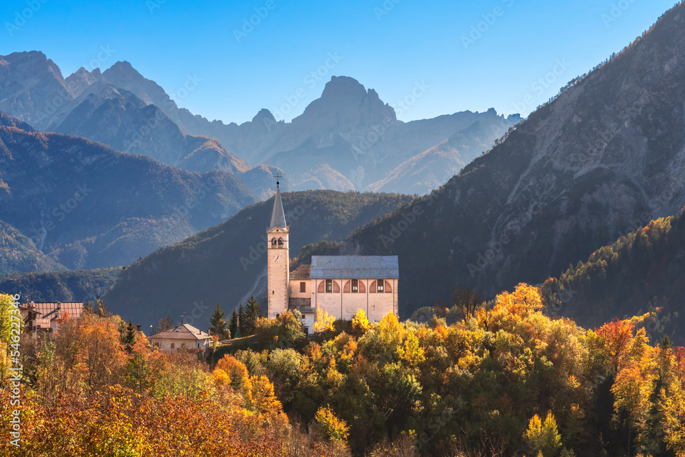 Church in the mountains in autumn, Dolomites, Veneto, Italy