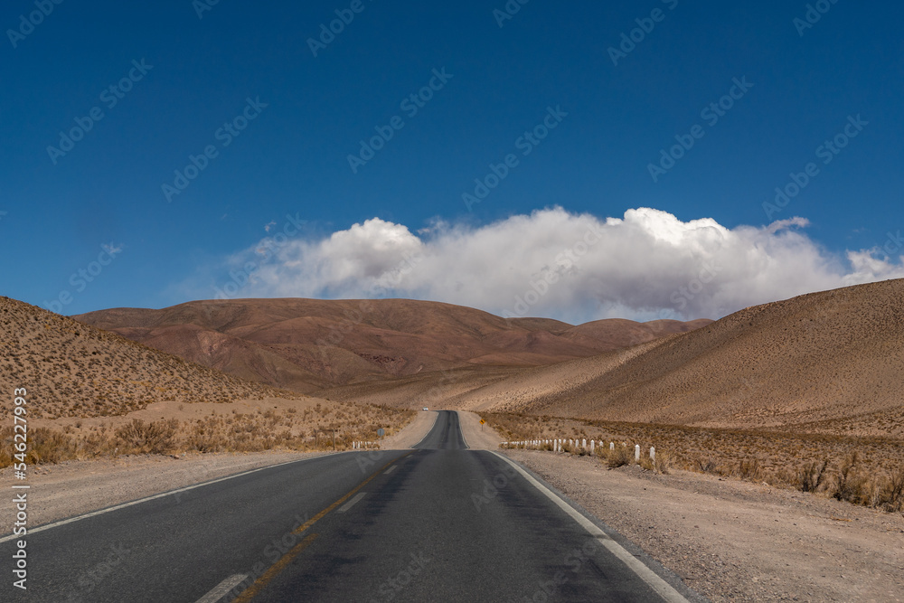 Travel into the unknown. Empty road in the Andes mountain range desert, on the way to Salta, Argentina. Travel into the unknown. Empty road in the Andes mountain range desert, on the way to Salta, Argentina.