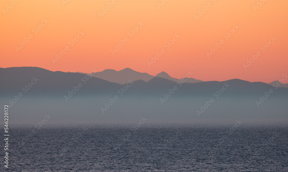 Ionian Sea with Mountain Landscape Background. Twilight Sunrise Sky. Katakolo, Greece.