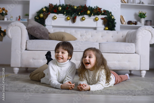 A young family with children decorates the house for the holiday. New Years Eve. Waiting for the new year.