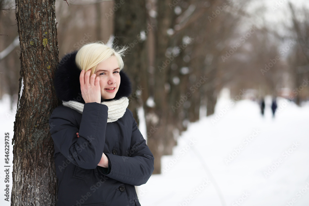 Young beautiful girl on a walk in winter park Young beautiful girl on a walk in winter park
