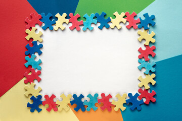 Autism Awareness Day, World Autism Day, rectangular frame with puzzle pieces, copy-space. Design element or background for flyer, poster for Health Care Awareness campaign for Autism