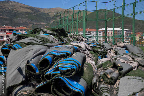 image of synthetic grass and garbage heap