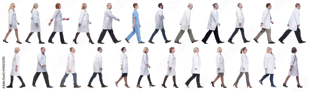 group of doctors in motion isolated on white