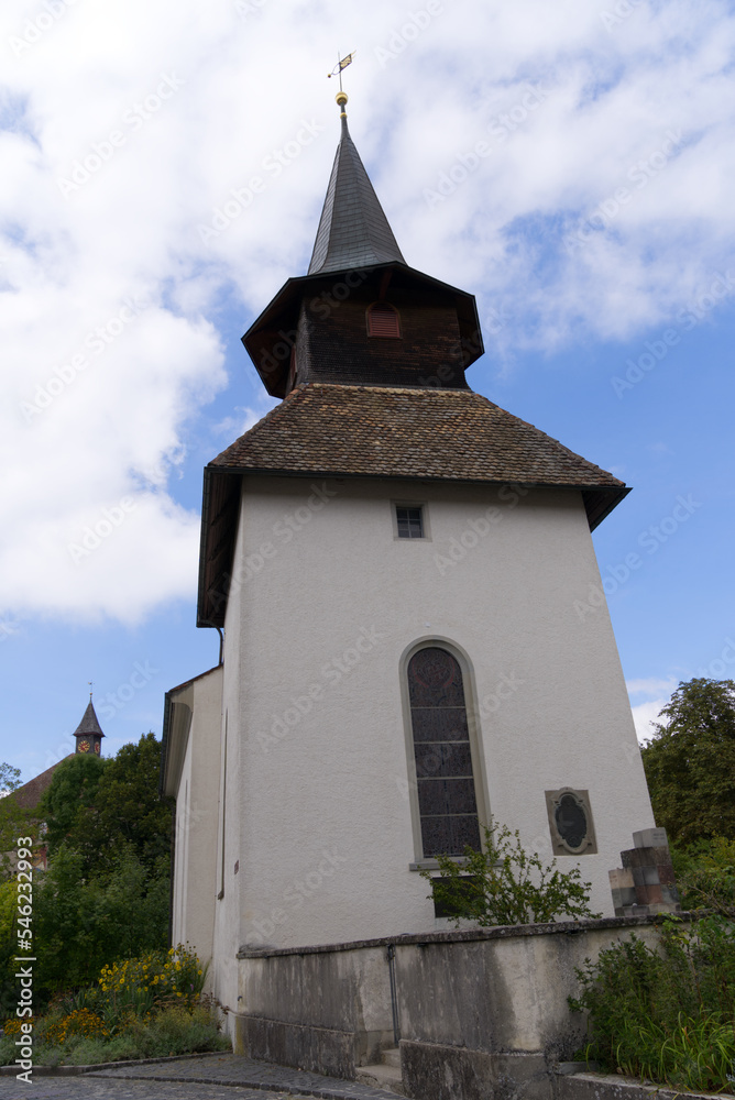 Medieval church at village of Kyburg, Canton Zürich, on a blue cloudy summer day. Photo taken September 1st, 2022, Kyburg, Switzerland.