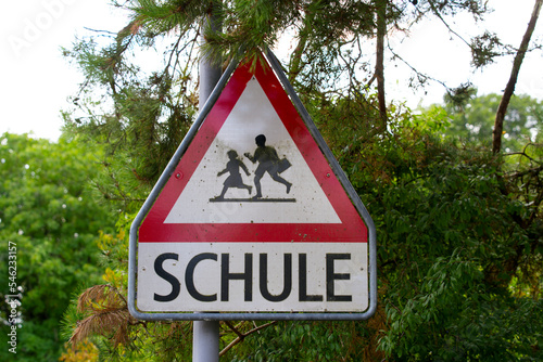 Road sign beware of school children at rural village Kyburg, Canton Zürich, on a cloudy late summer day. Photo taken September 1st, 2022, Kyburg, Switzerland.