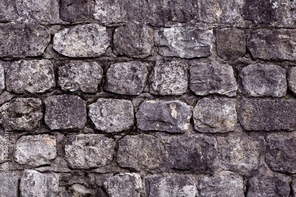 Fototapeta premium Closeup of vintage stonewall background