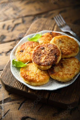 Homemade savory potato pancakes with fresh basil © marysckin