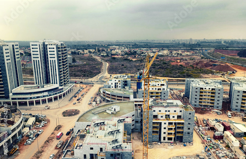 Construction of houses in Israel 2022. View from a high-rise building. selective focus