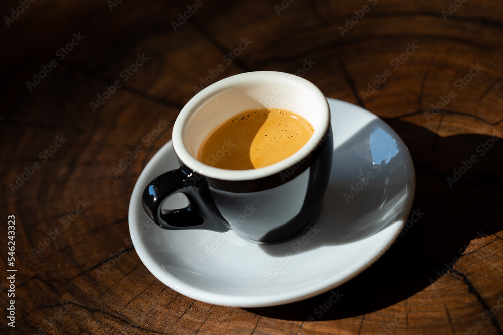 Espresso with thick crema in a black cup Espresso with thick crema in a black cup