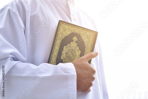 Muslim man reading holy quran. islamic concept
