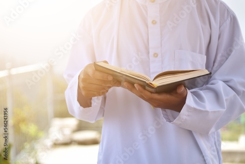 Muslim man reading holy quran. islamic concept