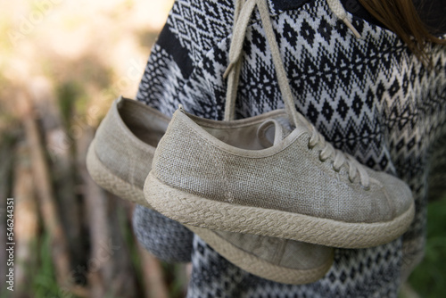 Linen boots worn over the shoulder