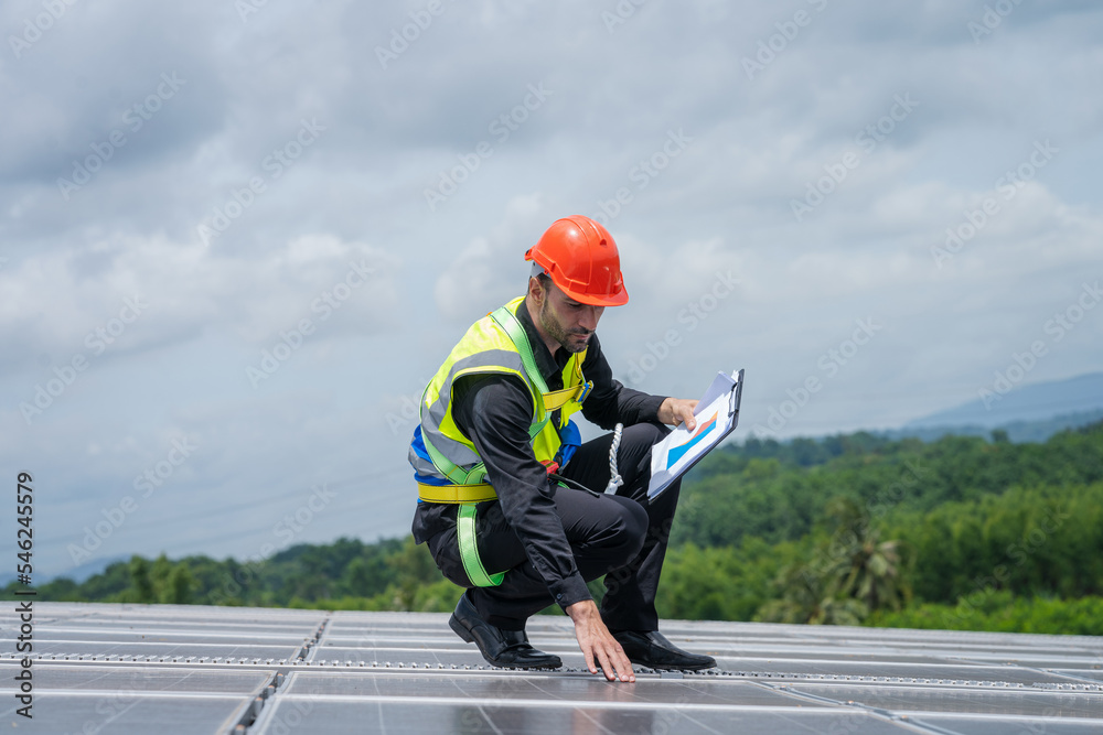 Technicians are checking solar panel,Engineer service check installation solar cell on the roof of factory. Technicians are checking solar panel,Engineer service check installation solar cell on the roof of factory.